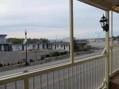 a balcony with a view of a parking lot at Villa Nova Motel in Wasaga Beach