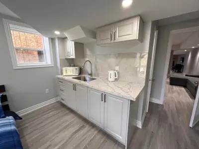a kitchen with a sink and a counter top at Whitby Hideout - 3BR, 5BD, 3WR, Pool Table, Sauna in Whitby