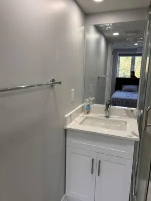 a bathroom with a sink and a mirror at Whitby Hideout - 3BR, 5BD, 3WR, Pool Table, Sauna in Whitby