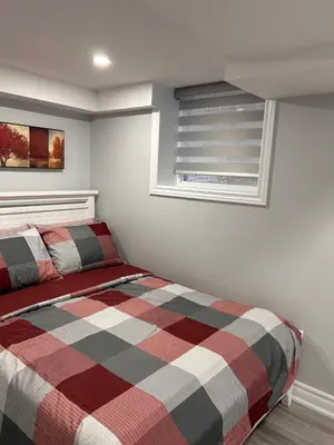 a bedroom with a bed and a window at Whitby Hideout - 3BR, 5BD, 3WR, Pool Table, Sauna in Whitby