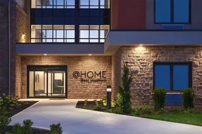 a brick building with a store sign on it at @HOME by Best Western Walkerton in Walkerton
