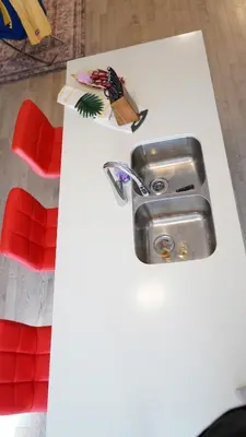 a white table with a white counter top with a silver sink at Newly Built 3 plus 1 bedroom Ravine lot Townhouse, Brampton, Ontario in Brampton