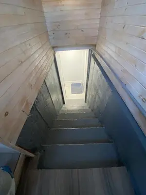 a staircase leading up to a window in a building at 2 bedroom 2 bath separate basement unit in Cambridge