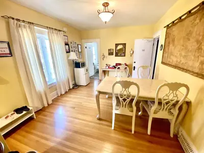 a dining room with a table and chairs at Two bedrooms unit with jacuzzi in Niagara Falls