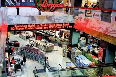 an overhead view of a grocery store with people in it at Exquisite Living Toronto in Toronto
