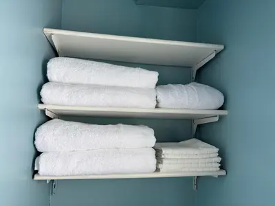 a group of towels are arranged in a closet at Waterfront Cottage Near Toronto Private Dock, Water Crafts, BBQ Wi-Fi - Sleeps 4 in Manvers
