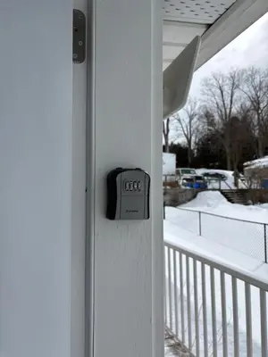 a clock on the side of a porch with snow at Waterfront Cottage Near Toronto Private Dock, Water Crafts, BBQ Wi-Fi - Sleeps 4 in Manvers