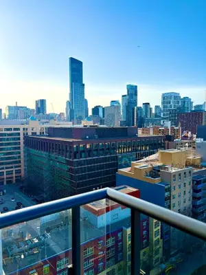a view of a city skyline from a balcony at Sweetheart studio with city views in Toronto