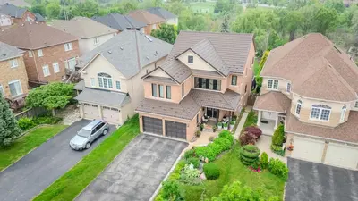 an aerial view of a house with a car in the driveway at Richmond Hill Ravine Retreat in Richmond Hill