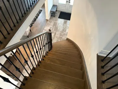 a wooden staircase with a wooden rail and a wooden floor at The Angus Nest in Angus