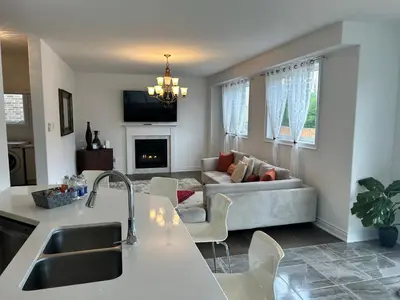 a kitchen and a living room with a couch at The Angus Nest in Angus