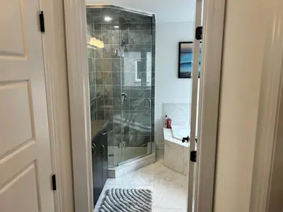 a bathroom with a walk in shower and a sink at The Angus Nest in Angus