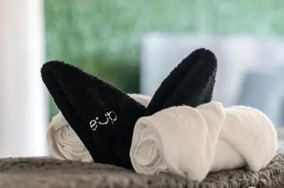 a pair of towels with a rabbit on them at Discounted Elegant Yorkville Suite in Toronto