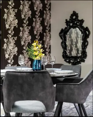a dining room table with a vase of flowers on it at Casa Hotel Elegant Suite w Patio BBQ Grill in Toronto