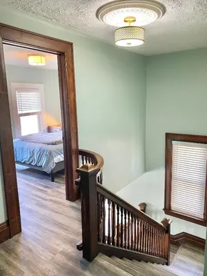 a room with a stairway leading to a bedroom at Cozy Suite-Walk to the Falls in Niagara Falls