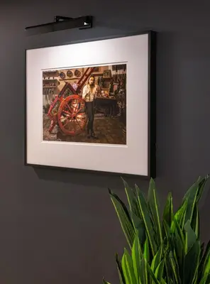 a painting of a woman standing next to a wheel on a wall at The Studio Southampton in Southampton