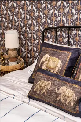 a bedroom with a bed with a pillow and a lamp at The Studio Southampton in Southampton