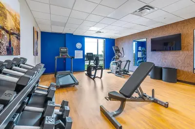 a gym with treadmills and cardio equipment in a room at Comfort Inn & Suites in Bradford