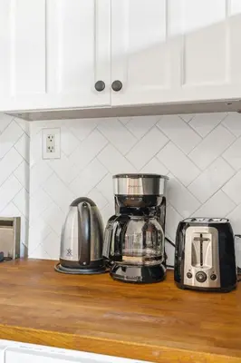 a kitchen counter with a toaster and a blender at Stylish & Spacious 3BR in Downtown Toronto in Toronto