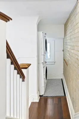 a laundry room with a washer and dryer at Stylish & Spacious 3BR in Downtown Toronto in Toronto