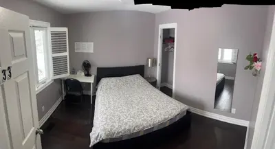 a bedroom with a bed and a desk in it at Bright Private Single Bedroom Q33 in Mississauga