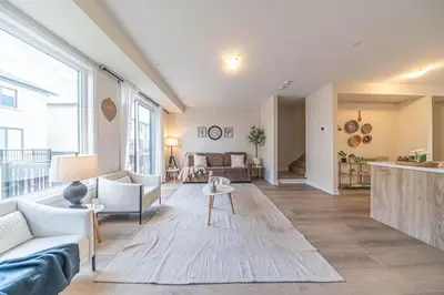 a living room with a couch and a table at Entire home in Oakville, Canada in Oakville
