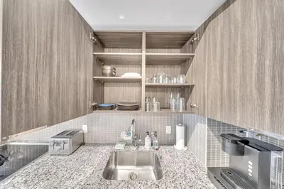 a kitchen with a sink and a counter top at Modern Condo with Balcony, Gym and Free Parking in Toronto