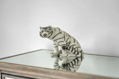 a white tiger standing on top of a mirror at Hidden 3BR Gem with Workspace, Fast wifi and Parking in Toronto