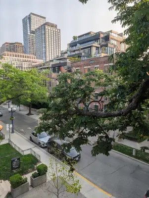 a view of a city with cars parked on a street at Hazelton Heritage in Toronto