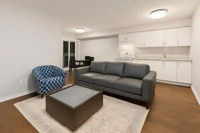 a living room with a couch and a table at 2 Bedroom Condo in Milton in Milton