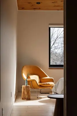 a yellow chair in a room with a window at Willow Creek - Modern Sunlit Bungalow in Hillier