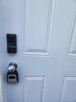 a white door with a lock and a socket on it at Gateway to Serenity-Welcome home in London