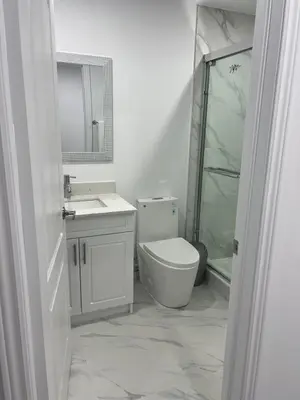 a bathroom with a toilet and a sink and a shower at Welcome to Skies Abode in Paris