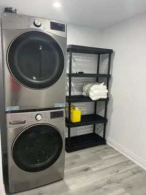 a washer and dryer sitting in a room at Welcome to Skies Abode in Paris