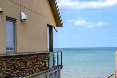 a building with a view of the ocean at Blue View Chalets in Blue Mountains