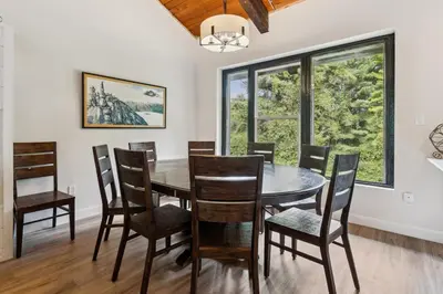 a dining room with a table and chairs at Blue View Chalets in Blue Mountains