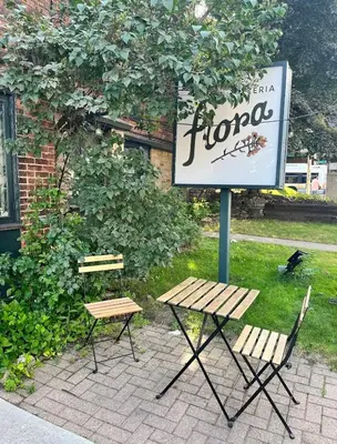 a sign and a picnic table and a bench at Bright 2bedroom apartment in Hamilton