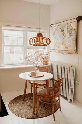 a dining room with a table and chairs and a window at Cozy Coach House in Kitchener
