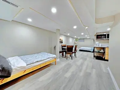 a bedroom with a bed and a dining room at Downtown Toronto Apartments in Toronto