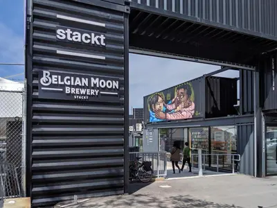 a building with a sign for a bilekin moon brewery at Downtown Toronto Apartments in Toronto