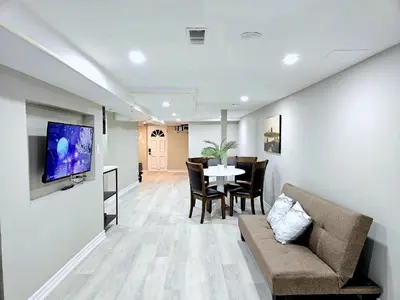 a living room with a couch and a table at Downtown Toronto Apartments in Toronto