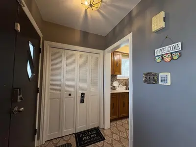 a kitchen with a white door and a sink at Cozy Stay, Self Check-In with Parking available upon request in Toronto