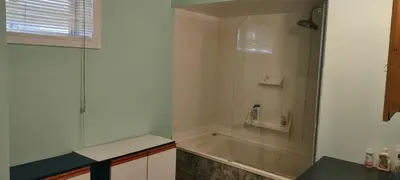 a bathroom with a sink and a bath tub at 2 bdrm apartment 3 min walk to McMaster University in Hamilton