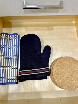 a pair of mittens sitting on the floor in a box at Bright Luxurious 2 Bedroom Apartment in Toronto