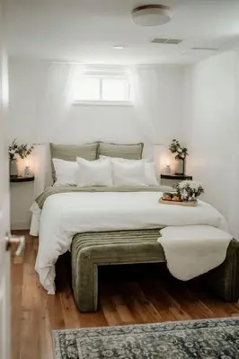 a bedroom with a large bed with white sheets and pillows at The Barrie Nook in Barrie
