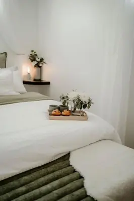 a bed with a tray with donuts on it at The Barrie Nook in Barrie