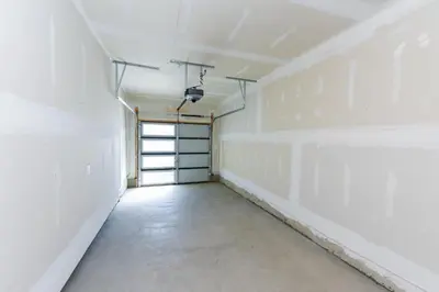 an empty room with a white wall and a door at Modern Home 10 mins from Niagara Falls & Main Attraction with Free 2 Parkings in Thorold