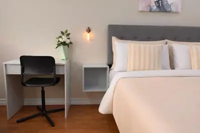 a bedroom with a bed and a desk and a chair at Vita House - Rogers Stadium and Yorkdale Mall Toronto - quiet and cozy bedrooms in Toronto