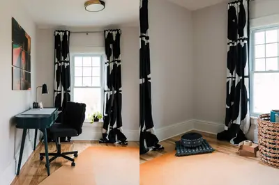 a room with black and white curtains and a desk at SquirrelHaus PEC in Hillier