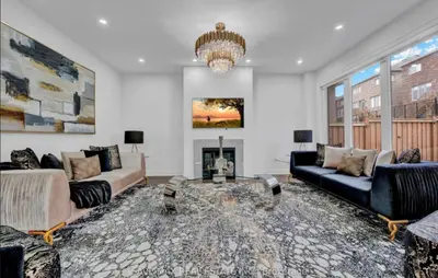 a living room with two couches and a fireplace at The Rustic Pearl in East Gwillimbury